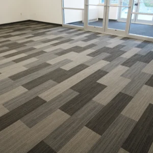 Gray carpet tiles with geometric design