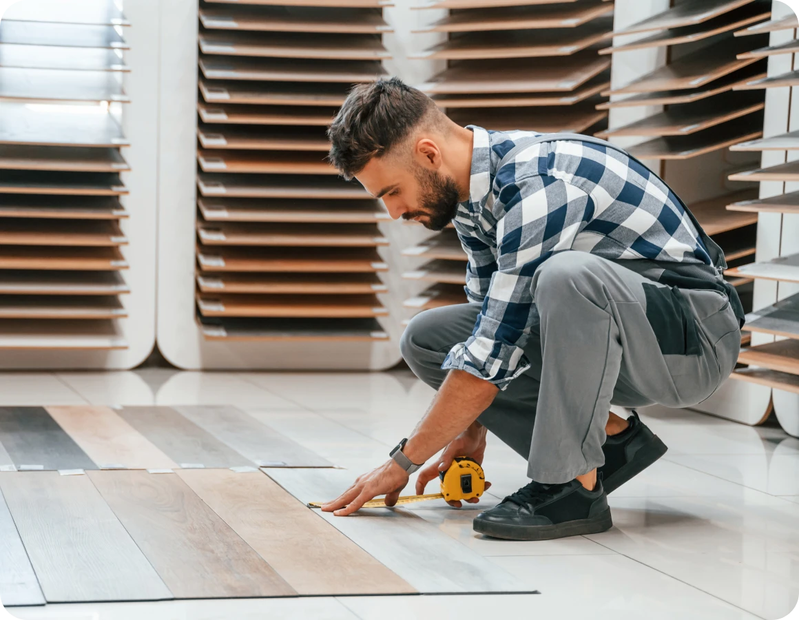Person selecting floor panels in store